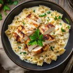 Farfalle pasta with creamy Alfredo sauce and chicken.