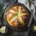 Freshly baked Kaiser roll with a golden crust and star pattern